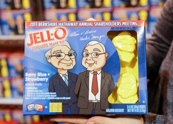 Jello mold kits featuring cartoon characters of Warren Buffett, left, and Charlie Munger, is offered for sale at the Berkshire Hathaway shareholders meeting at the CenturyLink Center in Omaha, Neb., Friday, May 5, 2017. More than 30,000 people are expected to attend the annual meeting, and participate in company-sponsored activities, though the main attraction is CEO Warren Buffett and Vice Chairman Charlie Munger's Q&A session on Saturday.