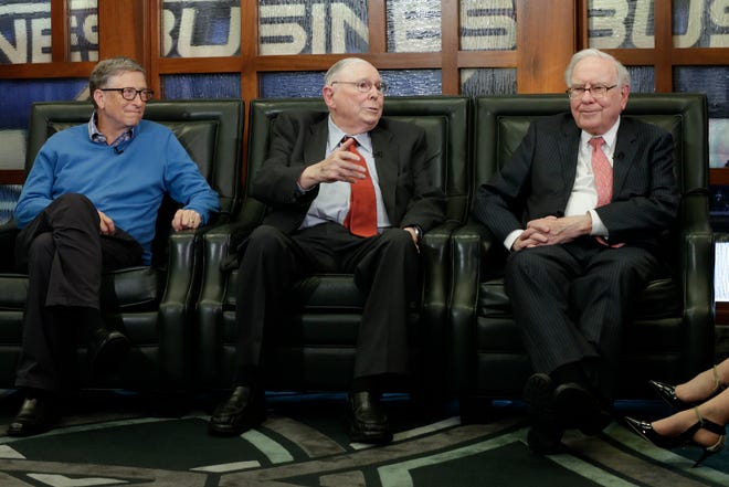 Berkshire Hathaway Chairman and CEO Warren Buffett, right, Vice Chairman Charlie Munger, center, and Bill Gates, left, Microsoft co-founder and director at Berkshire Hathaway, sit together during an interview with Liz Claman of the Fox Business Network in Omaha, Neb., Monday, May 8, 2017.